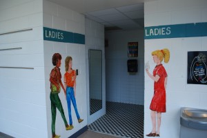 These photos depict an excellent utilization of murals to enhance student safety in the Chapel Hill, North Carolina Public School System.  This clear marking makes it less likely that an aggressor could claim they accidentally entered the girl’s restroom by mistake.  They also reduce the chances of students suffering embarrassment from the common problem of people entering the wrong restroom by mistake.